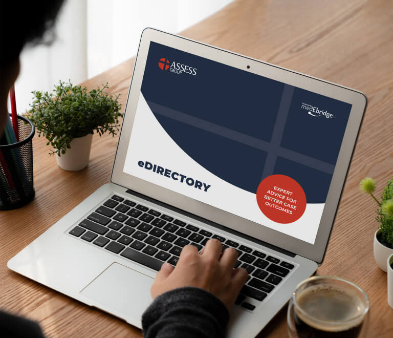 Laptop open on Assess medical Group website, designed and developed by MOO Marketing web design agency in Melbourne