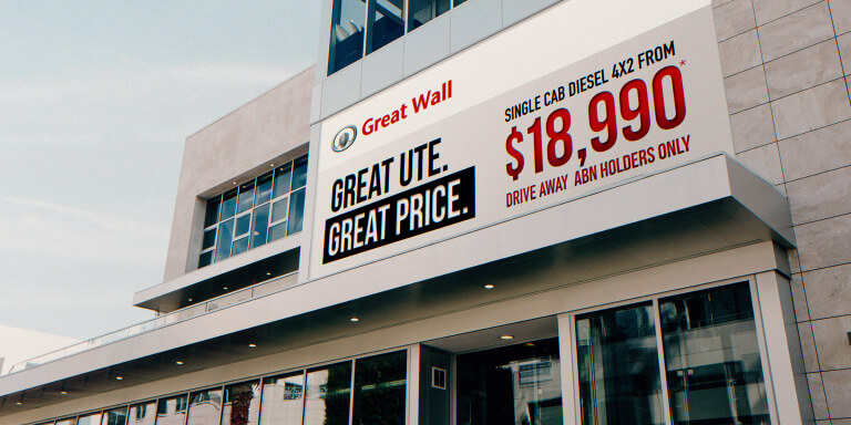 Price signage on the side of a Great Wall Motors dealership