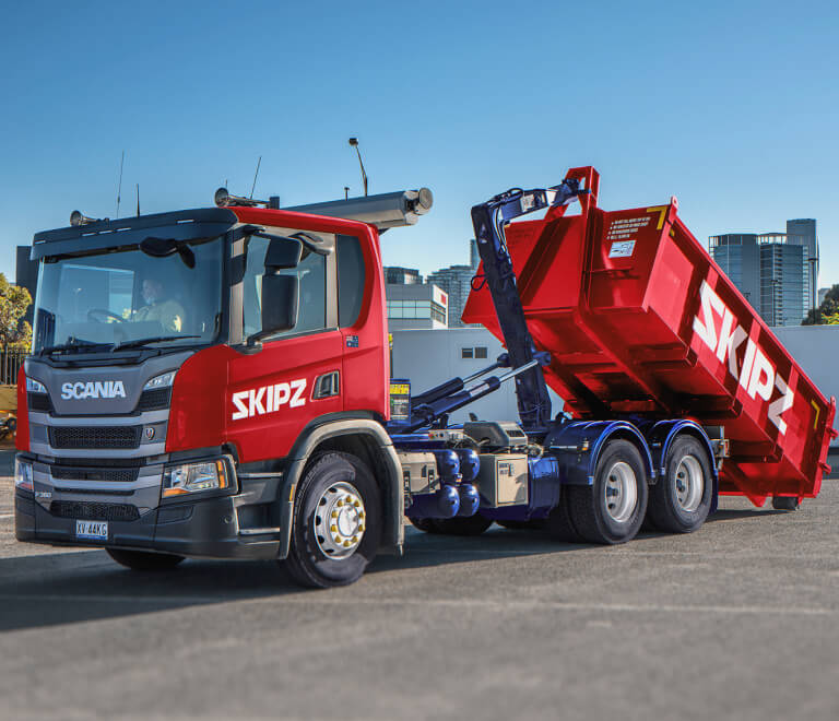 Skip loader truck with Skipz logo